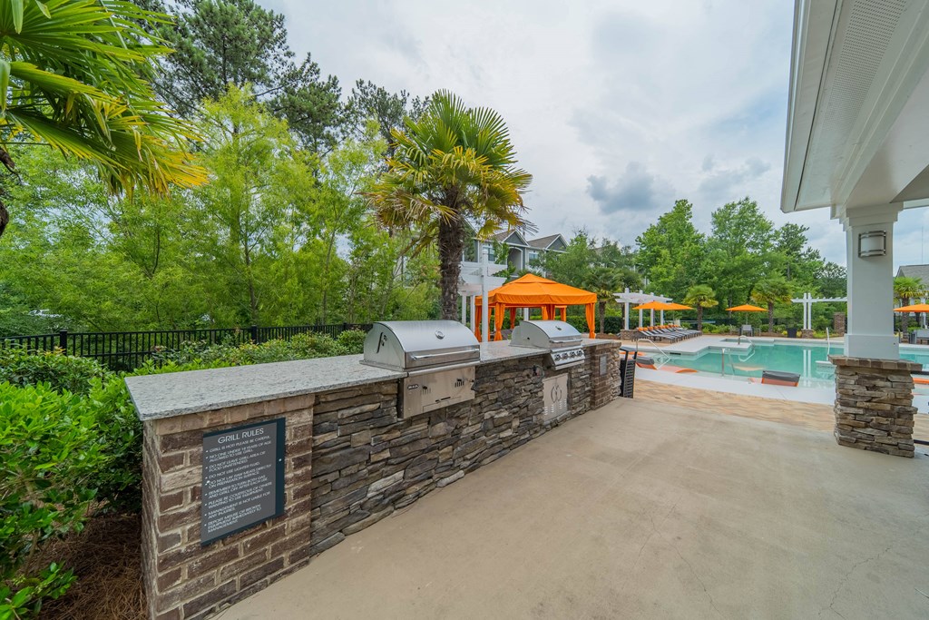 the preserve at ballantyne commons concierge desk and pool area with trees